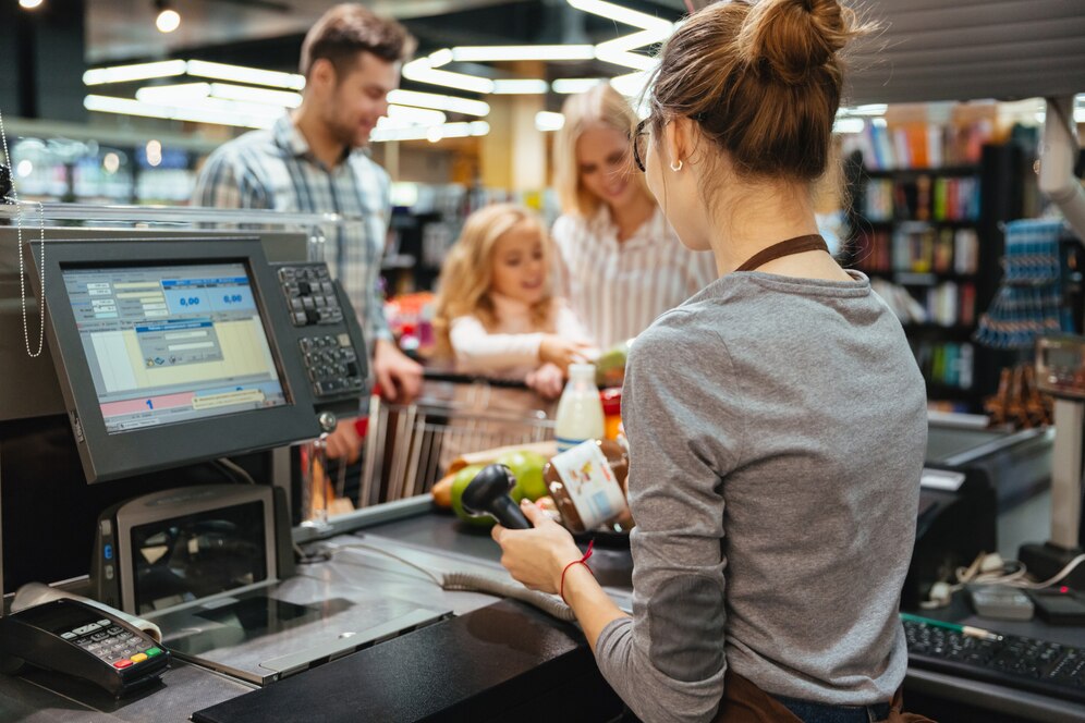 beautiful-family-standing-cash-counter_171337-2410